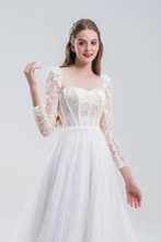 Load image into Gallery viewer, A romantic A-line wedding dress with lace long sleeves, illusion details, and a flowing tulle skirt for an elegant, timeless bridal look
