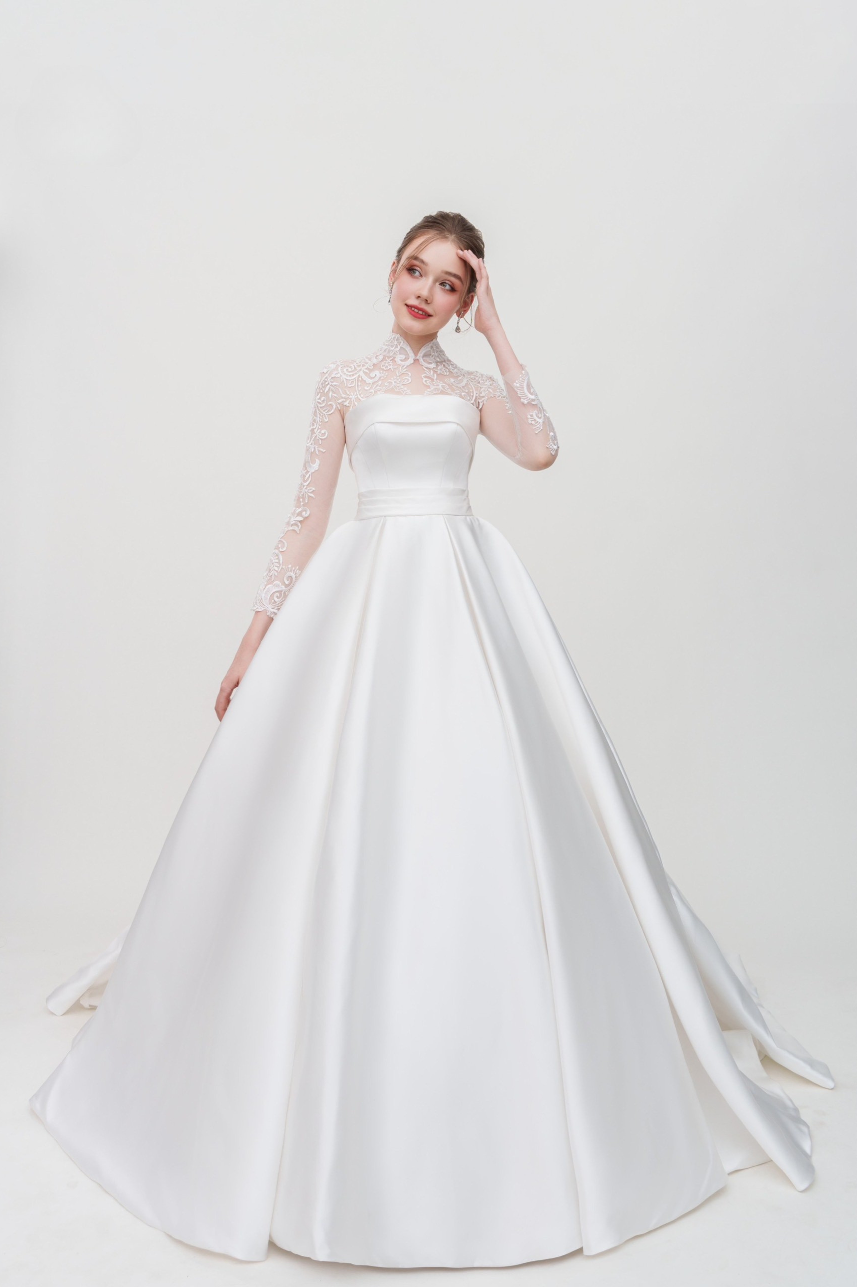 Satin ballgown wedding dress with long lace sleeves and pleated waist – classic and romantic bridal gown
