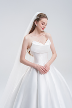 Load image into Gallery viewer, A strapless A-line wedding dress in satin with a sweetheart neckline, pearl and floral embellishments, flowing skirt, and sweeping train for timeless elegance

