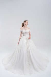 
Off-the-shoulder ball gown wedding dress with sparkling tulle, beaded bodice, and voluminous skirt for a romantic, princess-inspired bridal look
