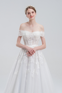 A-line wedding dress with convertible off-shoulder to strapless design, lace and bead details, and a shimmering tulle skirt for a romantic, elegant bridal look