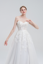 Load image into Gallery viewer, A-line wedding dress with convertible off-shoulder to strapless design, lace and bead details, and a shimmering tulle skirt for a romantic, elegant bridal look
