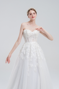 A-line wedding dress with convertible off-shoulder to strapless design, lace and bead details, and a shimmering tulle skirt for a romantic, elegant bridal look