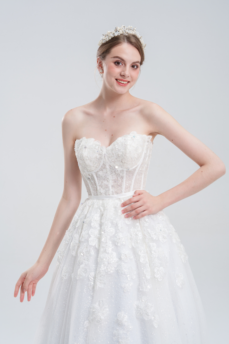 A-line wedding dress with convertible off-shoulder to strapless design, lace and bead details, and a shimmering tulle skirt for a romantic, elegant bridal look
