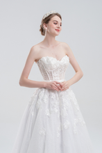 Load image into Gallery viewer, A-line wedding dress with convertible off-shoulder to strapless design, lace and bead details, and a shimmering tulle skirt for a romantic, elegant bridal look
