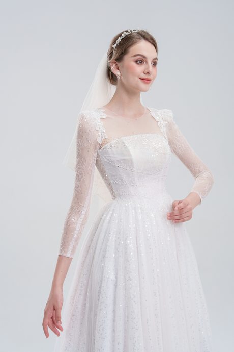 Elegant A-line wedding dress with long lace sleeves, sequin lace fabric, and intricate bead embroidery for a timeless, romantic bridal look.