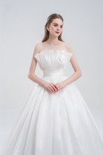 Load image into Gallery viewer, Strapless ball gown wedding dress in luxurious organza with a voluminous skirt, structured bodice, and ethereal layers for a romantic bridal look.
