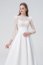 Load image into Gallery viewer, A stunning A-line wedding dress with long sleeves, flowing silhouette, soft fabric, and timeless elegance, perfect for modern and classic brides
