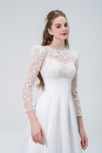 Load image into Gallery viewer, A stunning A-line wedding dress with long sleeves, flowing silhouette, soft fabric, and timeless elegance, perfect for modern and classic brides
