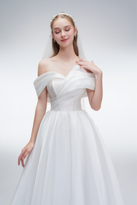 Off-shoulder organza A-line wedding dress with pleated bodice – romantic and lightweight bridal gown
