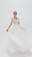 Load and play video in Gallery viewer, Elegant A-line wedding dress with lace puff sleeves, beaded bodice, and sparkling tulle skirt for a romantic, vintage-inspired bridal look
