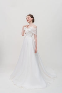 A-line wedding dress in organza with off-shoulder bow detail – elegant bridal gown for modern brides